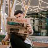 someone is reading a newspaper