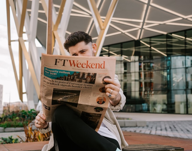 someone is reading a newspaper